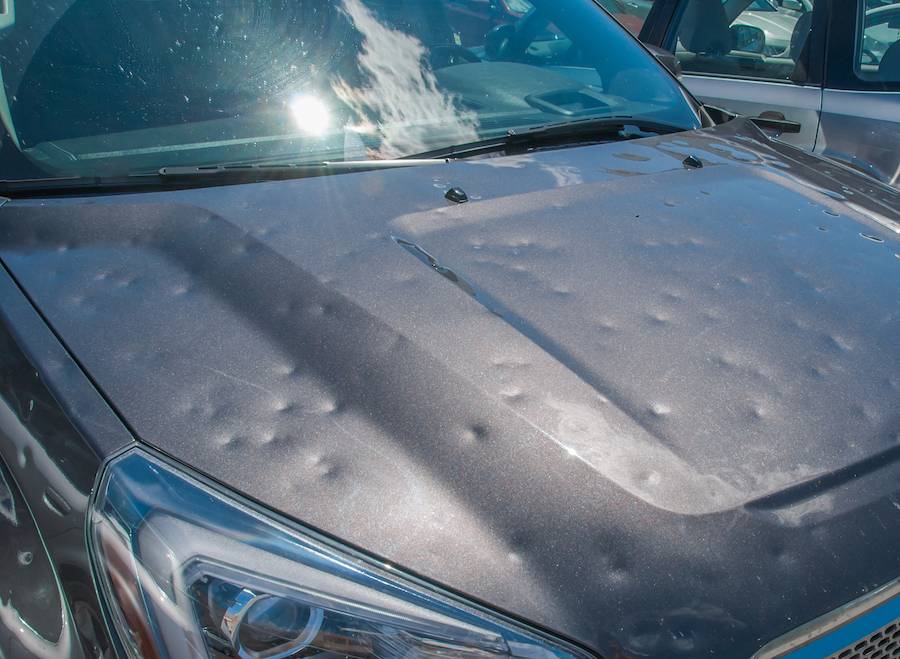 car that requires hail damage car repair in Chicago due to dents from hailstorm
